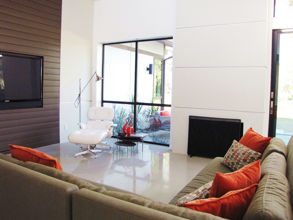 Inspiration for a 1950s living room remodel in Orange County with white walls and a wall-mounted tv