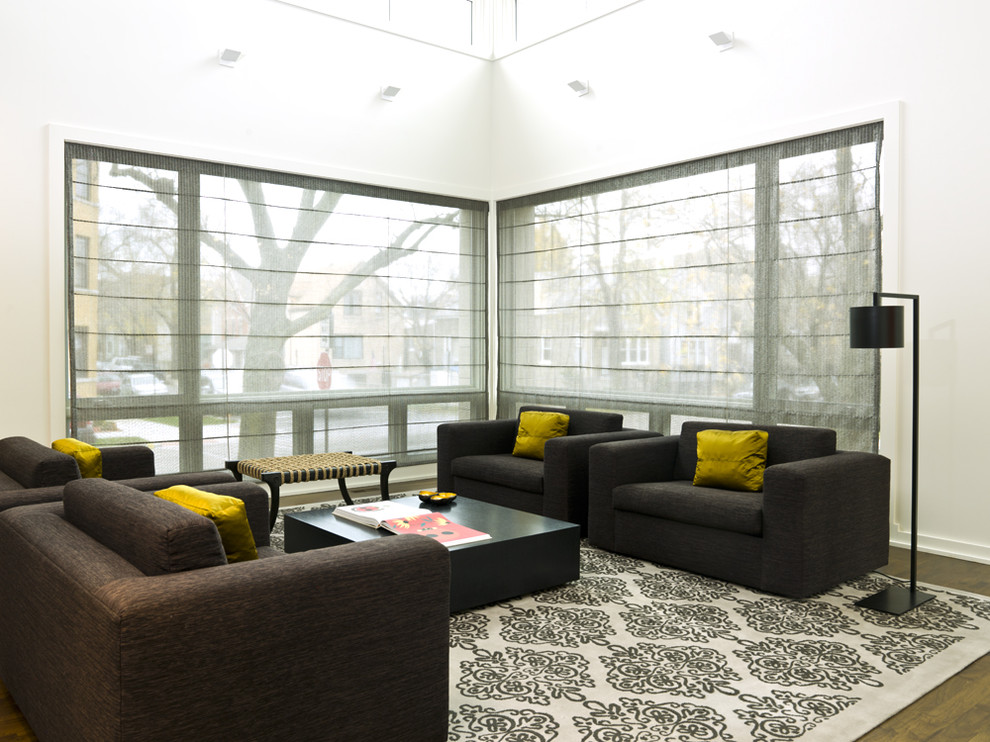 This is an example of a large modern living room in Chicago with white walls.