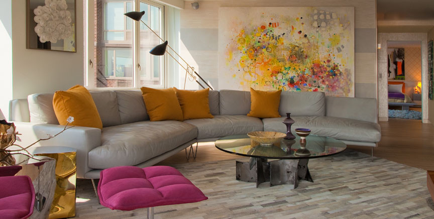 Medium sized modern open plan living room in New York with grey walls and light hardwood flooring.