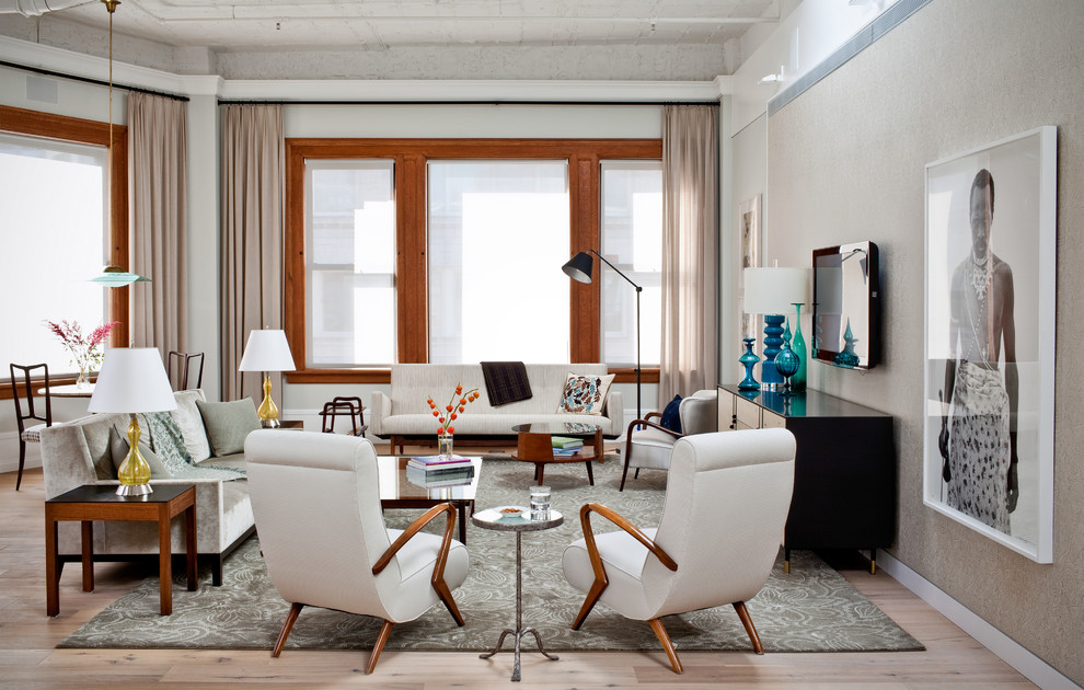This is an example of a contemporary living room in New York with grey walls.