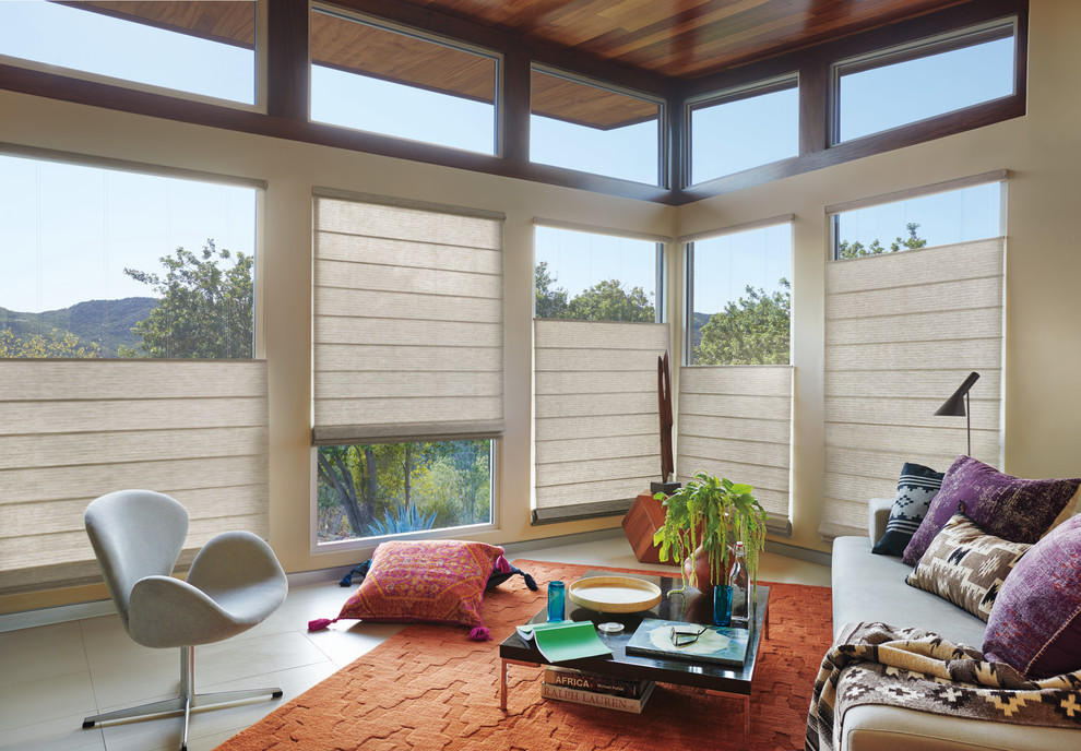 Идея дизайна: парадная, изолированная гостиная комната среднего размера в современном стиле с бежевыми стенами, бетонным полом и серым полом без камина, телевизора