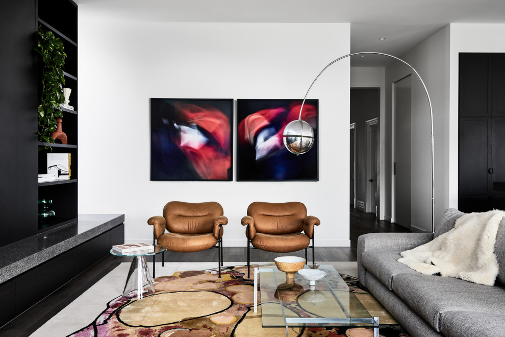 Trendy open concept dark wood floor and brown floor living room photo in Melbourne with white walls