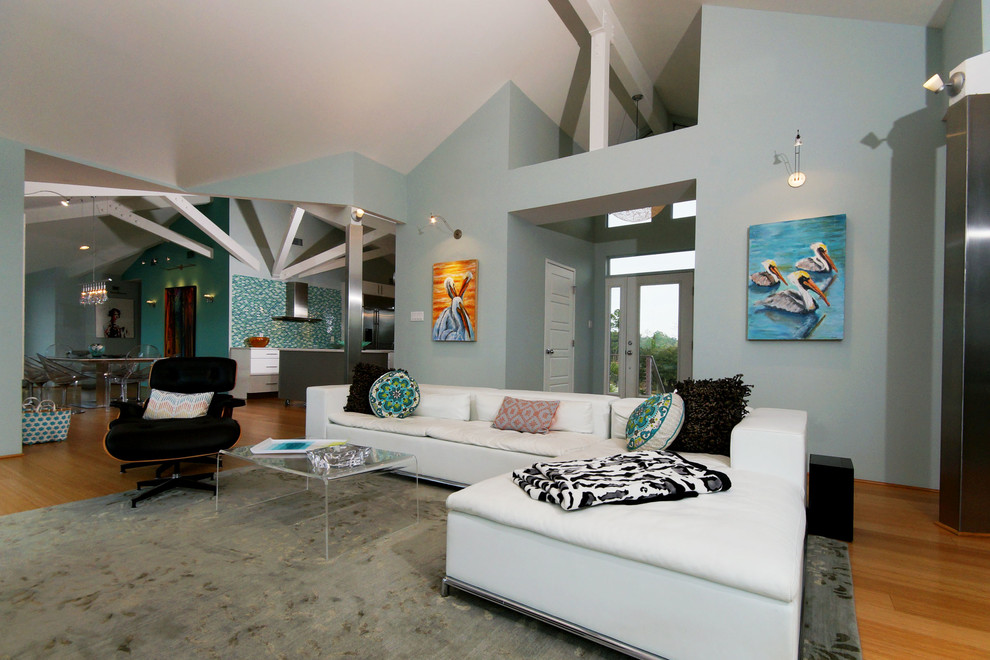 Living room - coastal bamboo floor living room idea in New Orleans