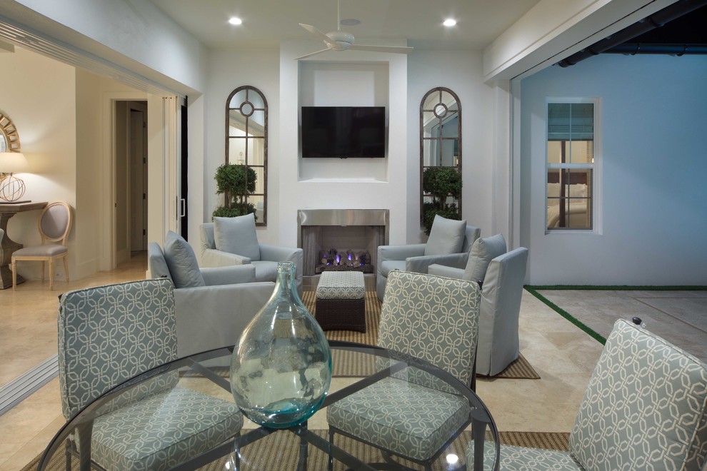 Transitional open concept living room photo in Orlando with white walls, a standard fireplace, a metal fireplace and a wall-mounted tv