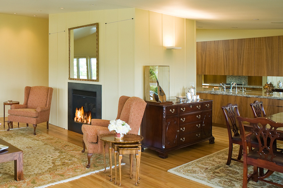Inspiration for a large 1960s formal and enclosed light wood floor and brown floor living room remodel in San Francisco with beige walls, a standard fireplace, a stone fireplace and no tv