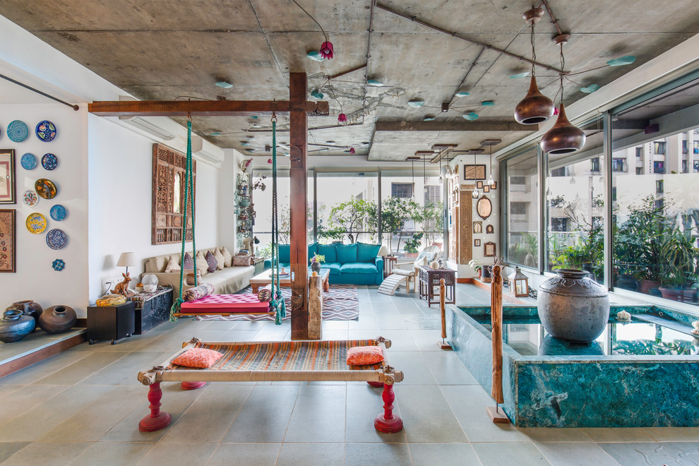 This is an example of a small eclectic living room in Mumbai.