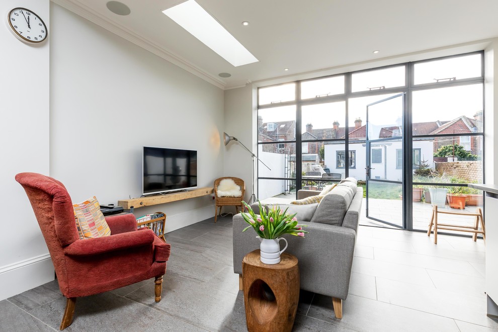 Example of a trendy open concept gray floor living room design in Hampshire