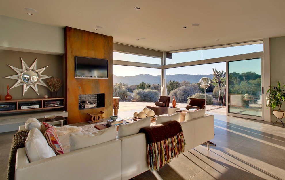Living room - large 1950s open concept concrete floor living room idea in Los Angeles with beige walls, a wall-mounted tv and a ribbon fireplace