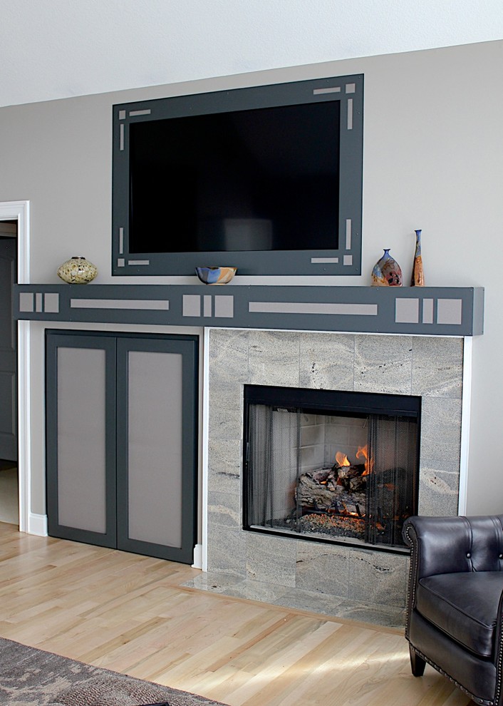 This is an example of a medium sized contemporary open plan living room in Charlotte with grey walls, light hardwood flooring, a standard fireplace, a stone fireplace surround and a built-in media unit.
