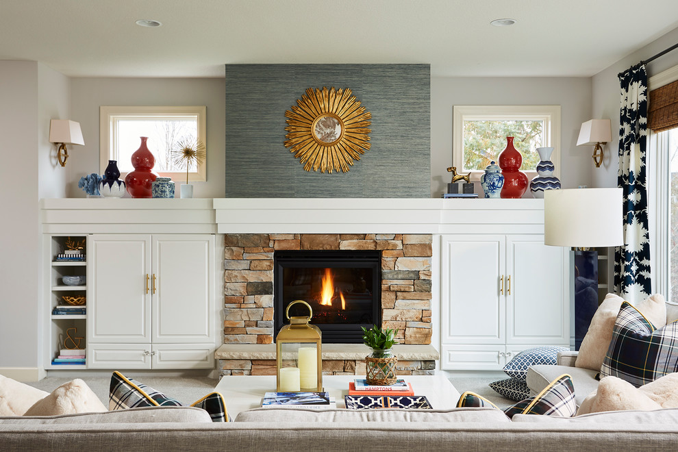 Inspiration for a large timeless open concept carpeted and gray floor living room remodel in Minneapolis with gray walls, a standard fireplace and a stone fireplace