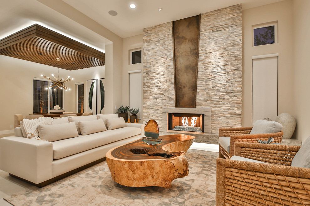 Design ideas for a medium sized contemporary formal open plan living room in Other with beige walls, a ribbon fireplace, a stone fireplace surround, no tv, beige floors and travertine flooring.