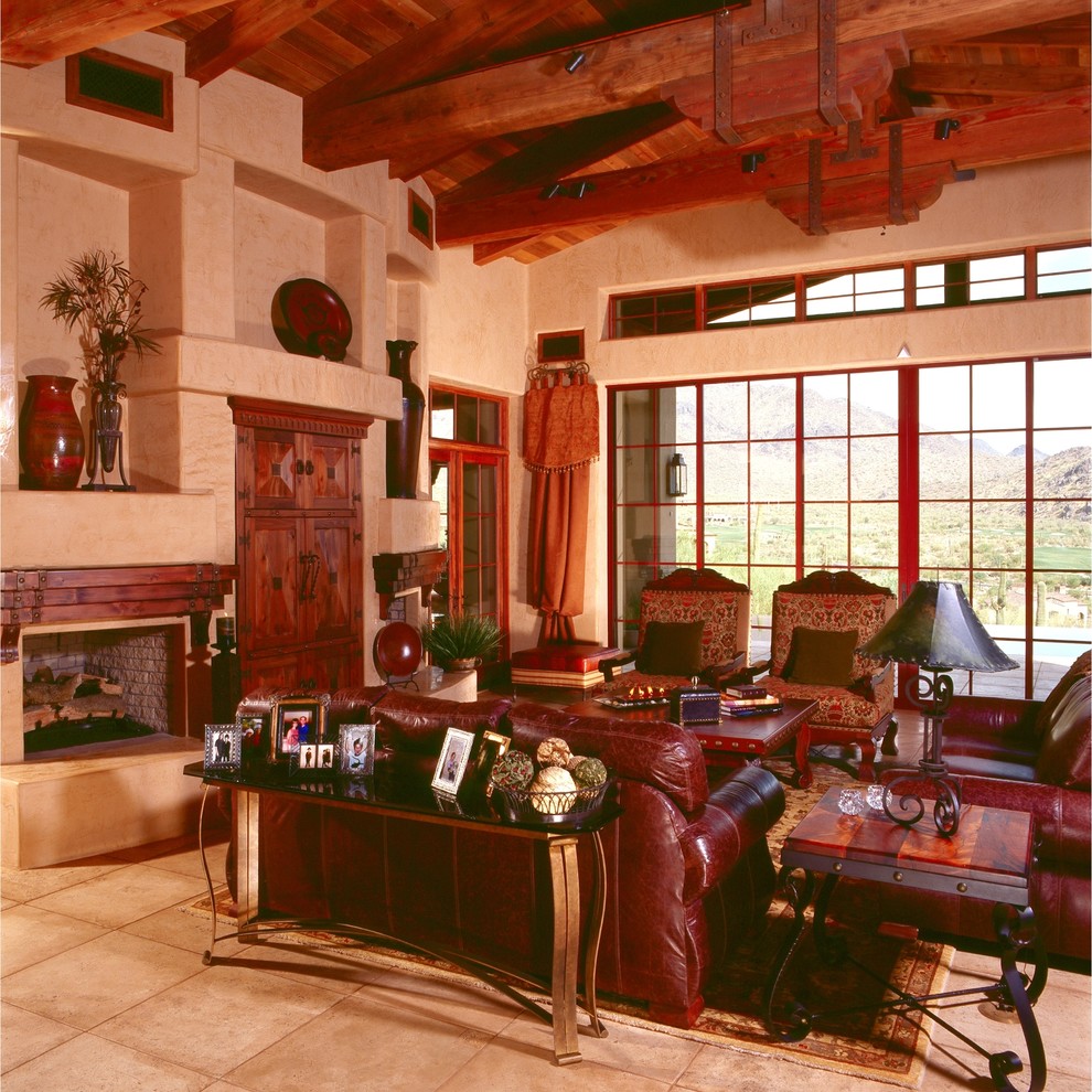 Cette image montre un très grand salon traditionnel ouvert avec une salle de réception, un mur beige, un sol en travertin, une cheminée standard, un manteau de cheminée en pierre et aucun téléviseur.