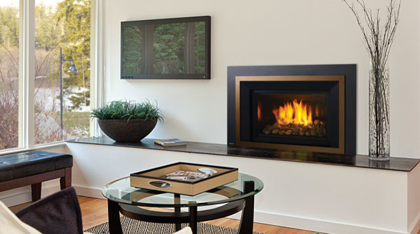 Example of a mid-sized classic enclosed medium tone wood floor and brown floor living room design in Phoenix with white walls, a standard fireplace, a metal fireplace and no tv