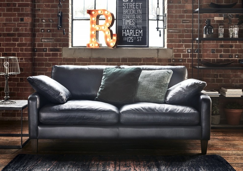 Example of an urban medium tone wood floor and brown floor living room design in Other