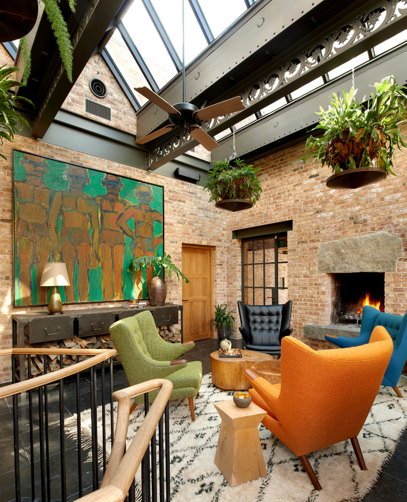 Living room - industrial living room idea in Chicago with a standard fireplace, a brick fireplace and no tv