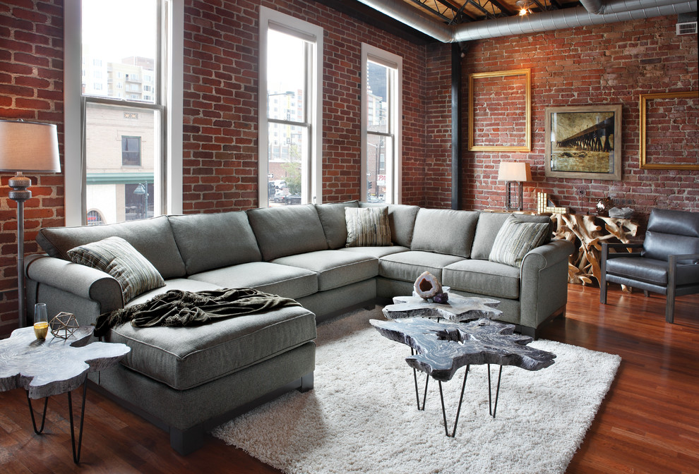 Example of a large urban open concept living room design in Denver with red walls
