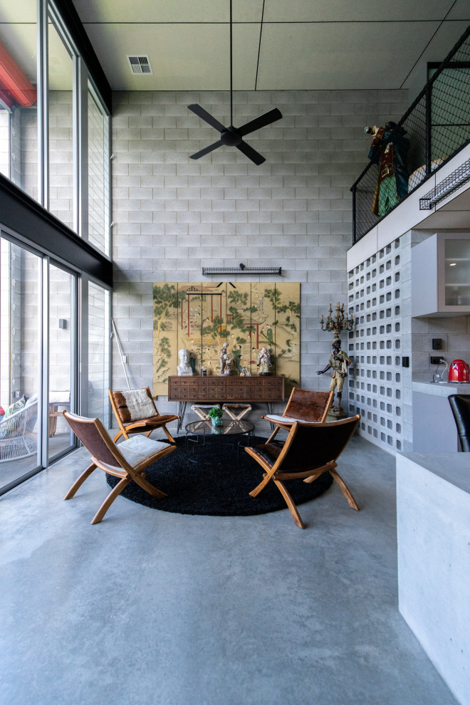 Свежая идея для дизайна: гостиная комната в стиле лофт - отличное фото интерьера
