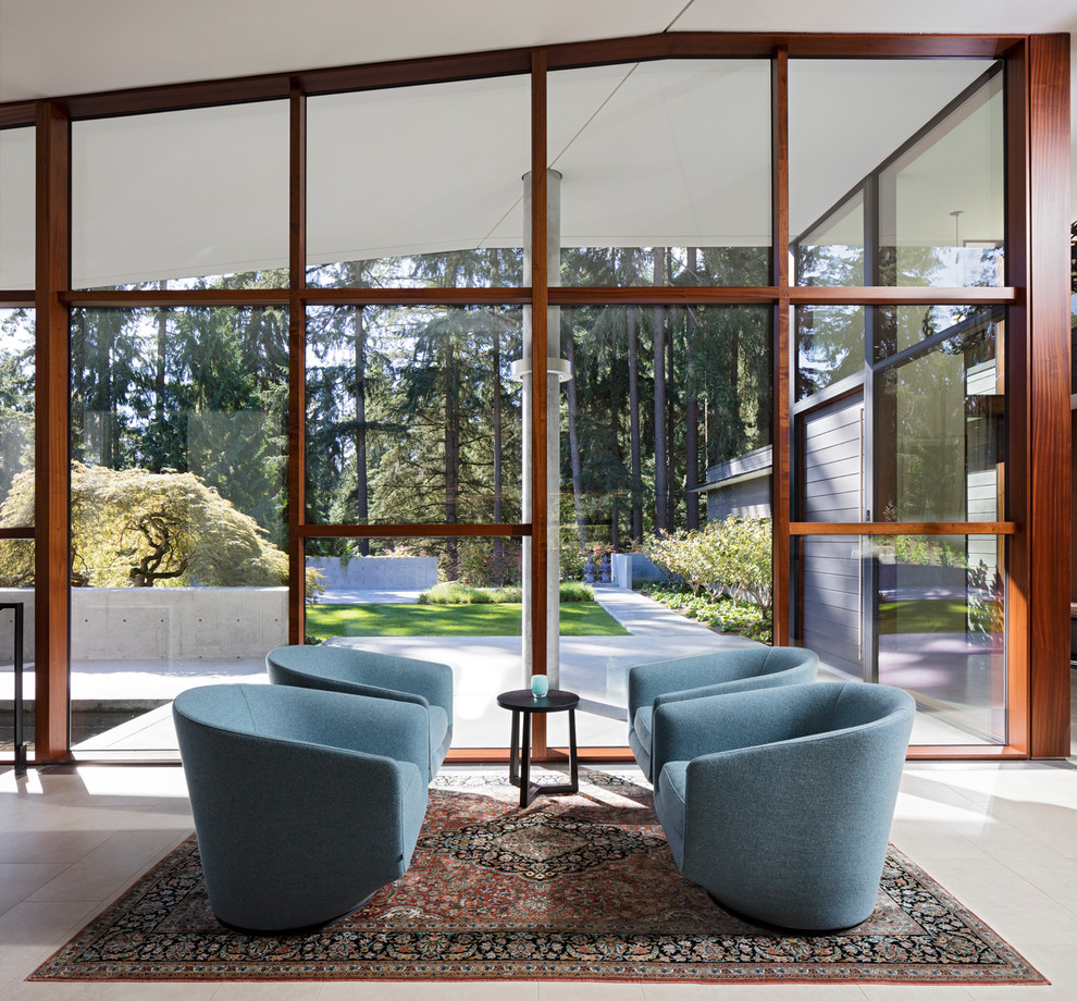 Contemporary open plan living room in Seattle with porcelain flooring.
