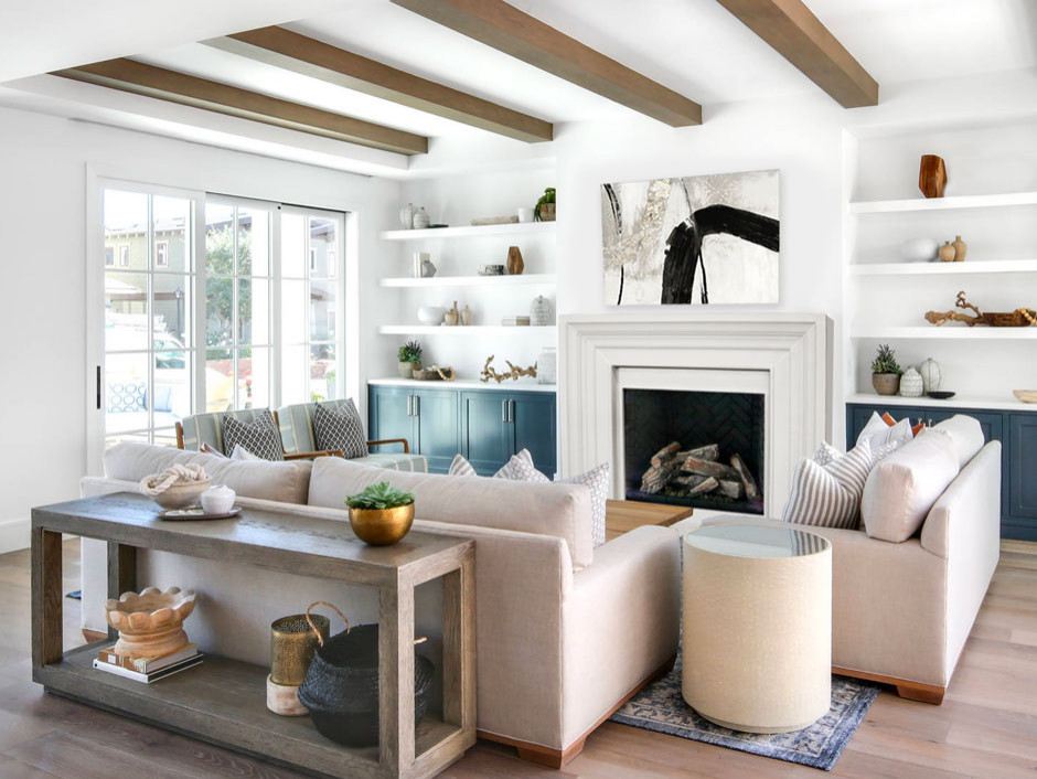 Photo of a medium sized beach style living room in Oklahoma City with white walls, bamboo flooring, a standard fireplace, a stone fireplace surround, brown floors and exposed beams.