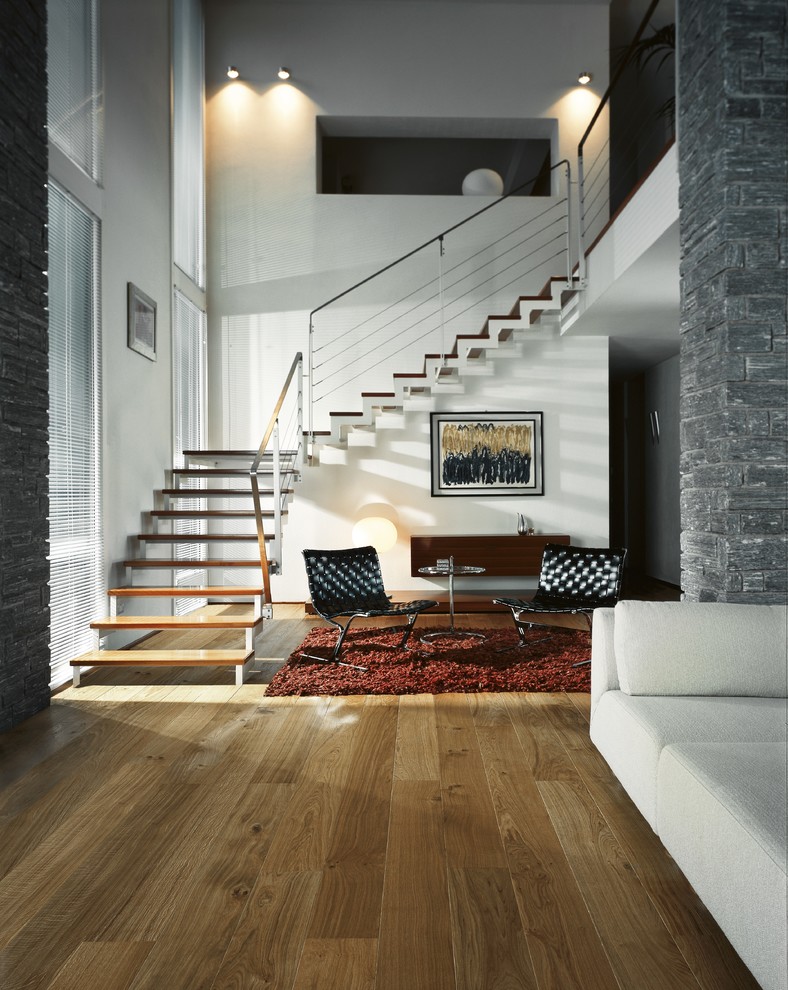 Inspiration for a large contemporary open concept medium tone wood floor living room remodel in Denver with red walls