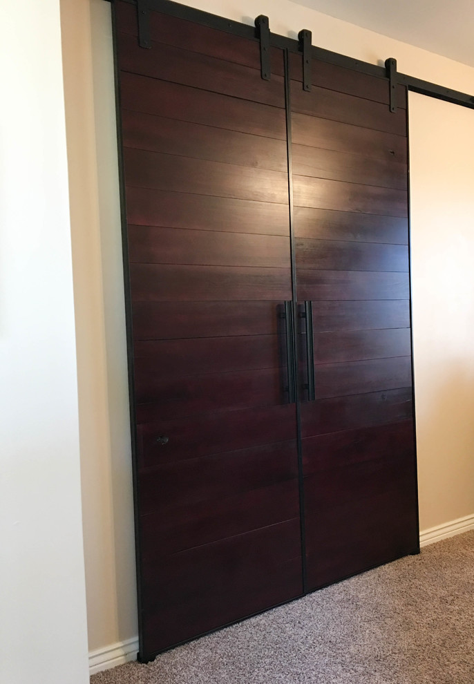 Installed Custom Double Sliding Wooden Cherry / Mahogany Barn Doors Traditional Living Room