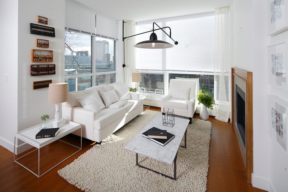 Exempel på ett modernt vardagsrum, med vita väggar