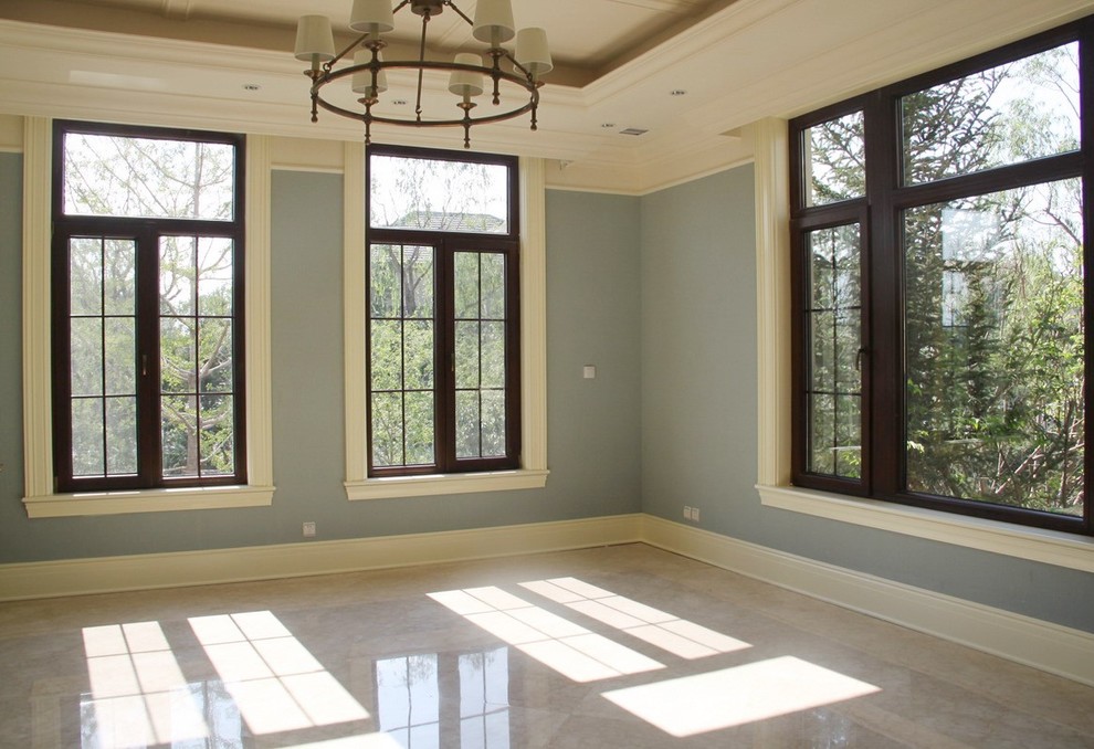 Photo of a large traditional open plan living room in St Louis with beige walls and dark hardwood flooring.