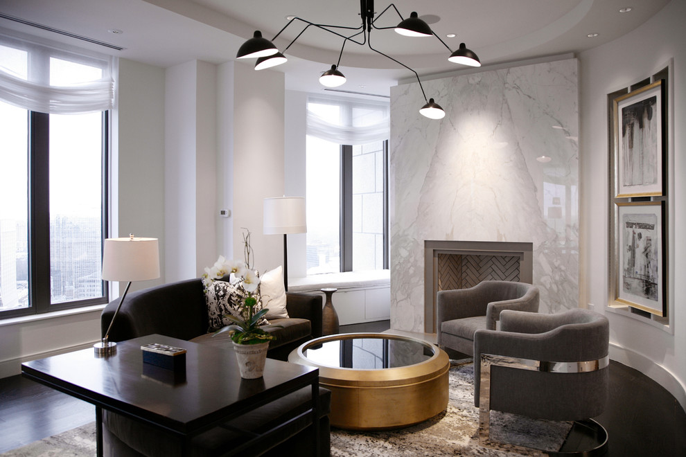 Contemporary living room in Atlanta with white walls, dark hardwood flooring and a standard fireplace.