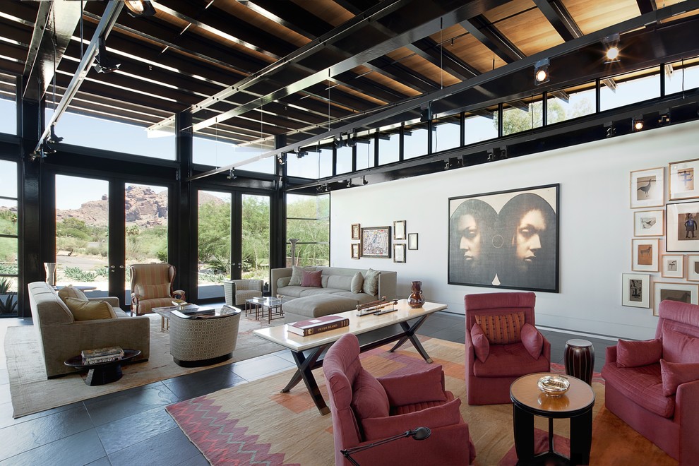 Photo of a large urban formal open plan living room in New York with white walls, slate flooring, no fireplace and no tv.