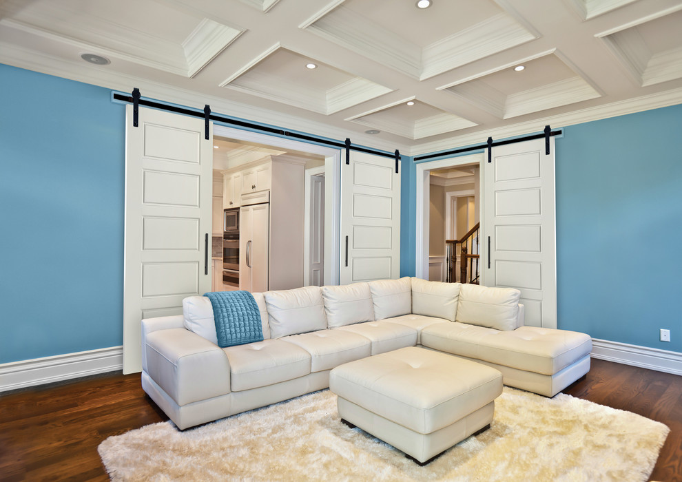 Exempel på ett mellanstort modernt separat vardagsrum, med blå väggar och mörkt trägolv