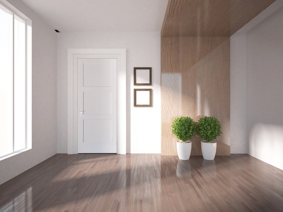 Стильный дизайн: парадная, изолированная гостиная комната среднего размера в современном стиле с белыми стенами, светлым паркетным полом и коричневым полом без камина - последний тренд