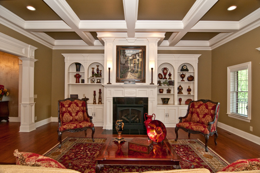 Example of a large classic formal and open concept medium tone wood floor living room design in Cincinnati with green walls, a standard fireplace, a wood fireplace surround and no tv