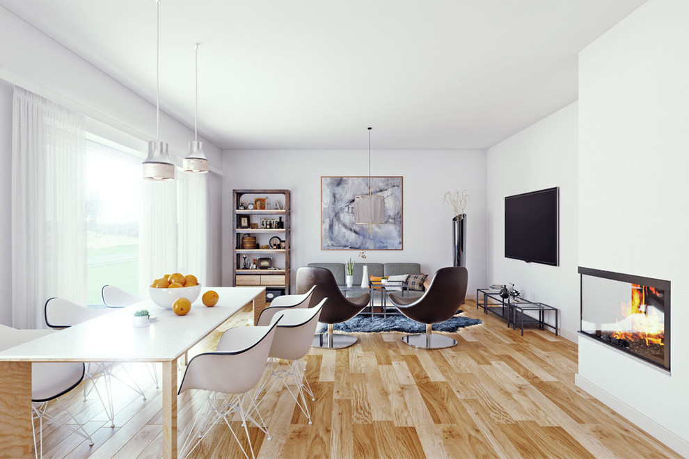 Aménagement d'un grand salon scandinave fermé avec une salle de réception, un mur blanc, un sol en bois brun, une cheminée d'angle, un manteau de cheminée en plâtre et un téléviseur fixé au mur.