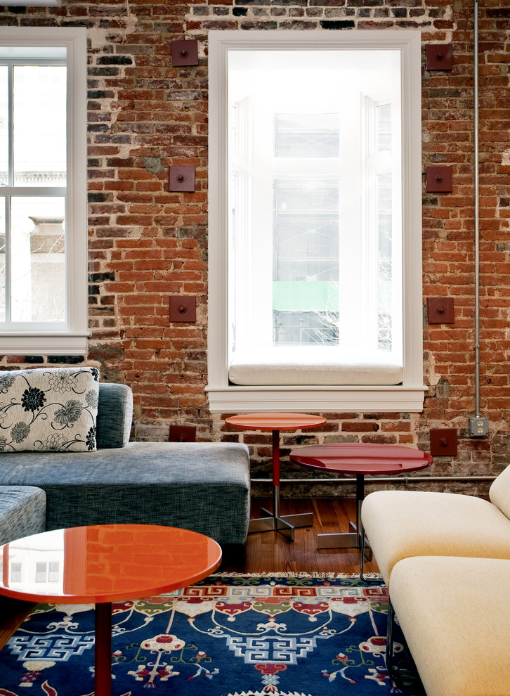 Photo of an eclectic living room in Baltimore with red walls.