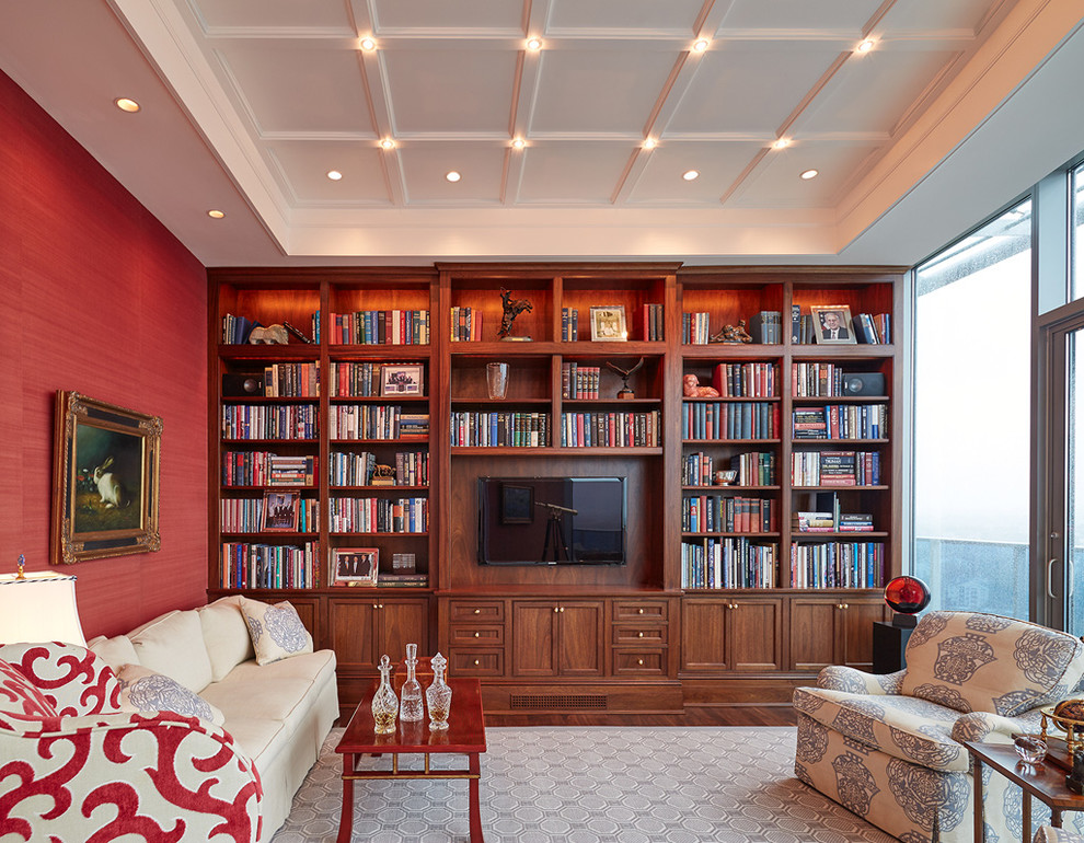 Exemple d'un salon chic de taille moyenne et fermé avec un mur rouge, parquet foncé, aucun téléviseur et un sol marron.