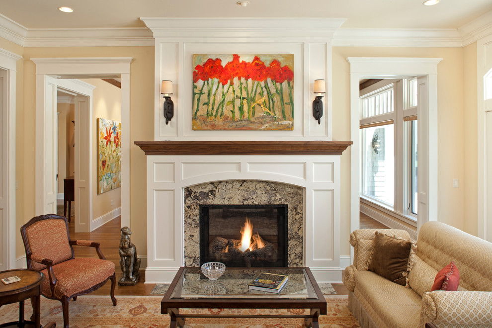 Example of a classic living room design in Minneapolis with yellow walls