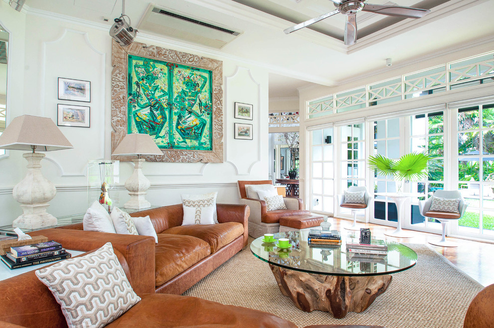 This is an example of a contemporary formal living room in Singapore with white walls, no fireplace and no tv.