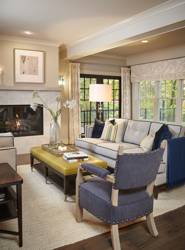 Example of a classic living room design in Grand Rapids with beige walls