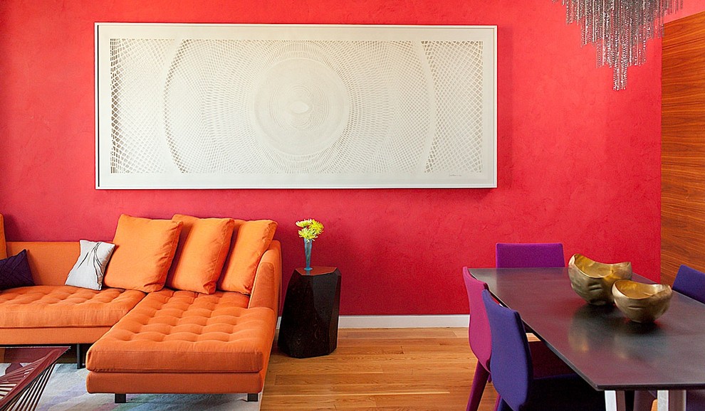 Trendy open concept medium tone wood floor living room photo in San Francisco with red walls and no tv