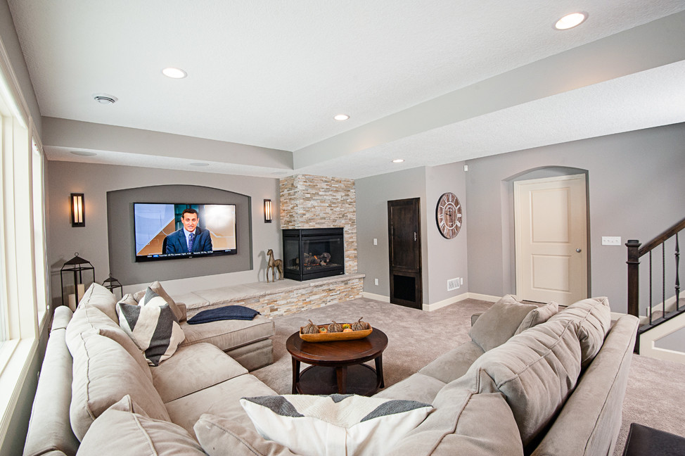 Example of a mid-sized classic formal and open concept carpeted living room design in Minneapolis with gray walls, a two-sided fireplace, a stone fireplace and a wall-mounted tv