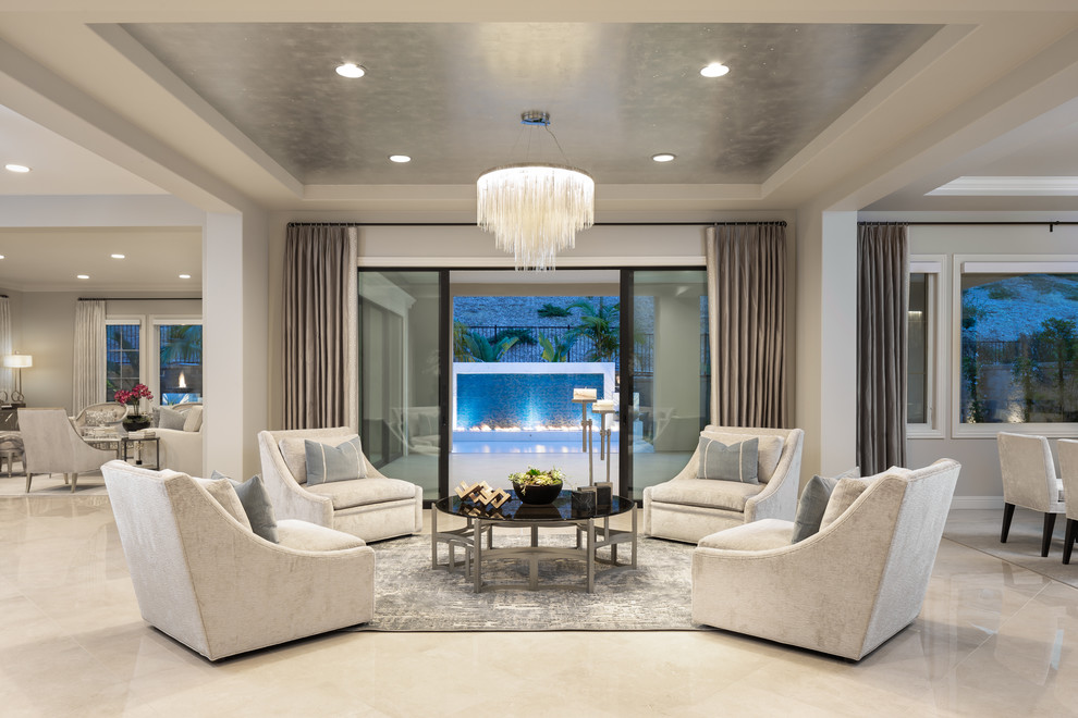 Idée de décoration pour un salon tradition ouvert avec une salle de réception, un mur gris, un sol en marbre et un sol beige.