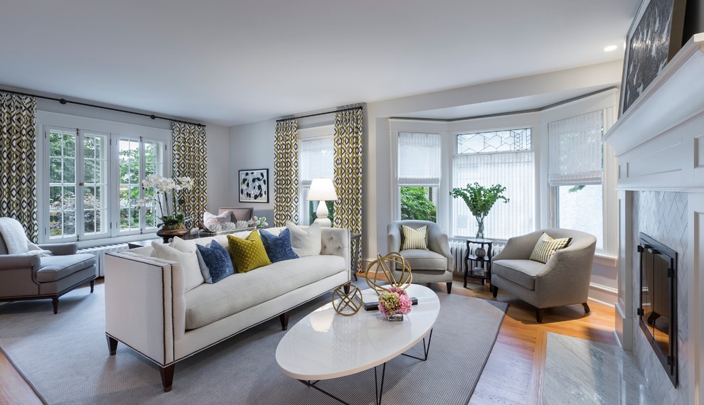 Example of a large transitional formal and enclosed light wood floor living room design in Minneapolis with gray walls, a standard fireplace, a tile fireplace and no tv