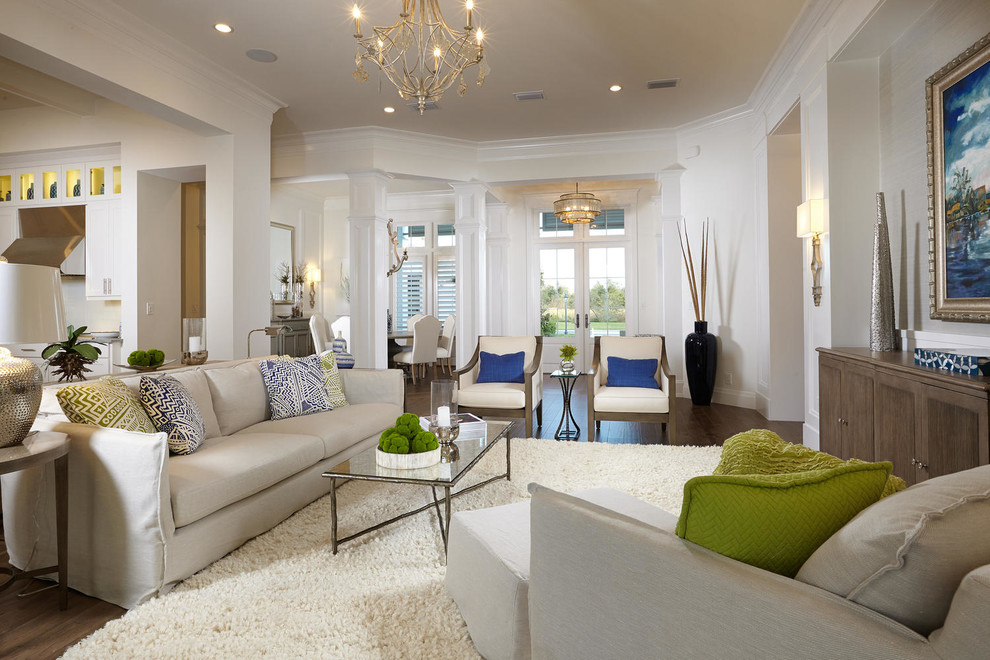 Photo of a contemporary open plan living room in Tampa with beige walls and dark hardwood flooring.
