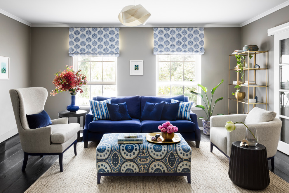 This is an example of a medium sized eclectic enclosed living room in Melbourne with grey walls, dark hardwood flooring, no fireplace, a wall mounted tv and brown floors.