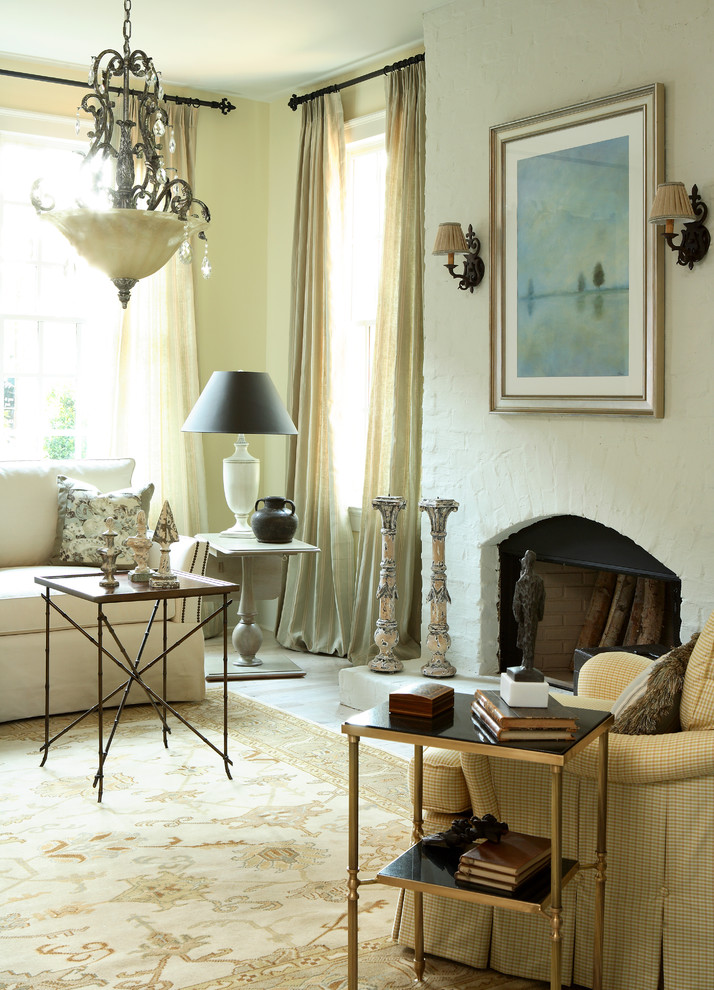 Living room - traditional living room idea in Atlanta with a brick fireplace