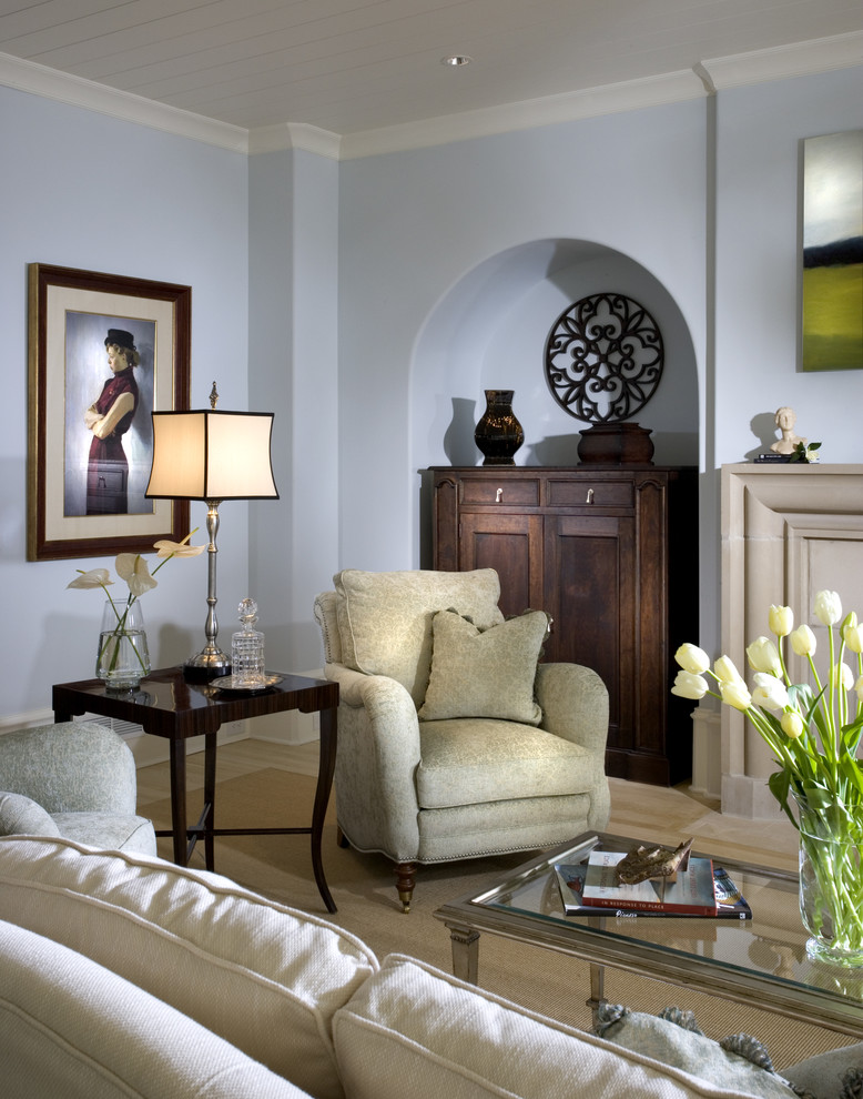 This is an example of a traditional living room in Atlanta with blue walls.