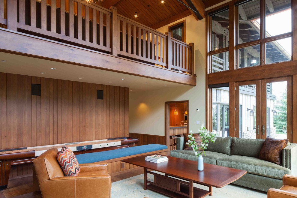 Expansive rustic living room in Portland with medium hardwood flooring.