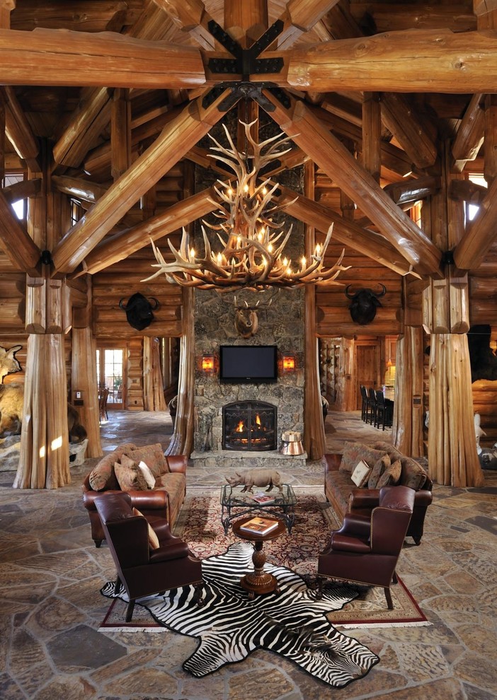 Inspiration for a huge rustic living room remodel in Boise with a standard fireplace and a stone fireplace