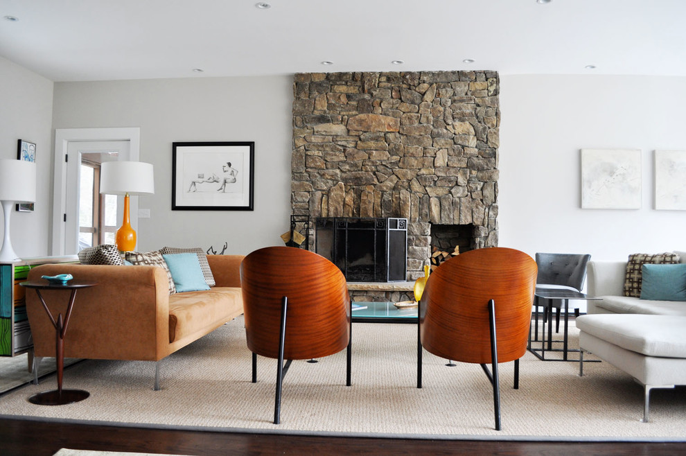 Inspiration for a contemporary formal and open concept dark wood floor living room remodel in Portland Maine with white walls, a standard fireplace and a stone fireplace