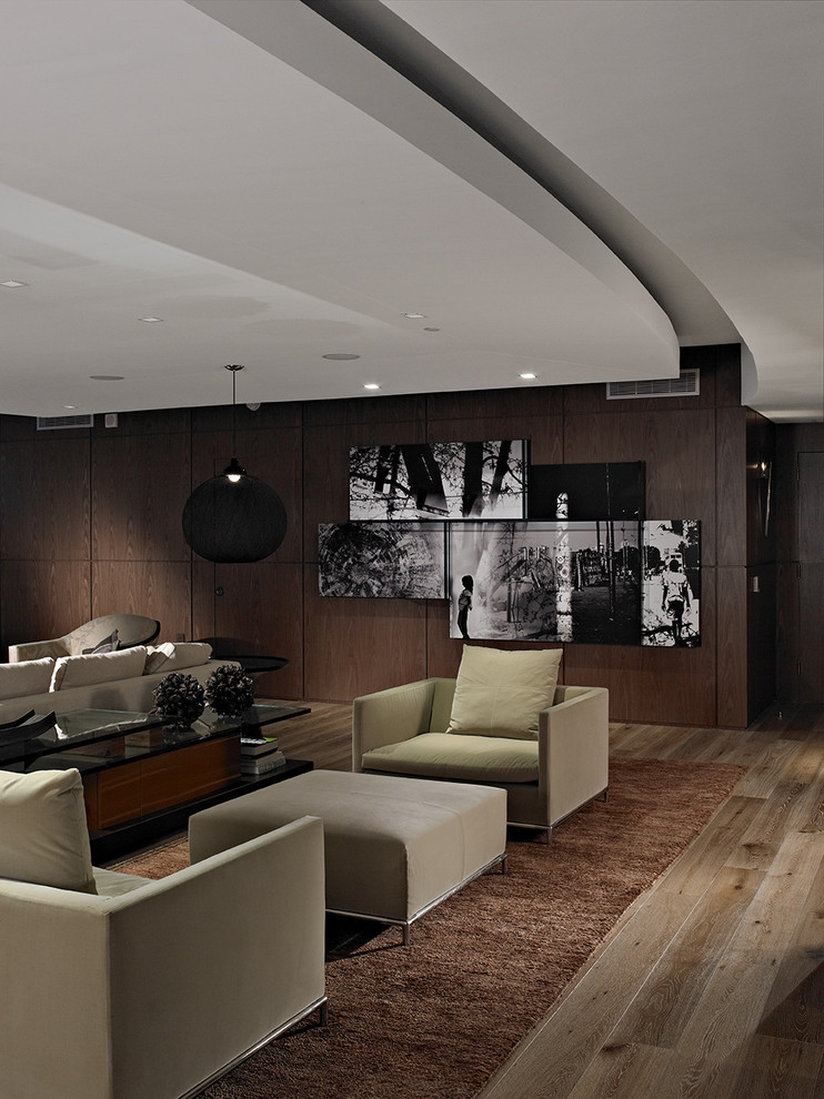 Foto de salón contemporáneo con paredes marrones